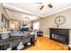 Spacious living room features a ceiling fan, fireplace, and hardwood floors throughout at 2622 Rolling Ridge Dr, Hickory, NC 28602