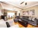 Inviting living room with a large gray sofa, hardwood floors, and plenty of seating at 2622 Rolling Ridge Dr, Hickory, NC 28602