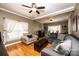 Spacious living room with a large gray sofa, hardwood floors, and a fireplace at 2622 Rolling Ridge Dr, Hickory, NC 28602