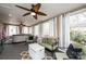 Bright sunroom with large windows, comfortable seating, and a ceiling fan at 2622 Rolling Ridge Dr, Hickory, NC 28602