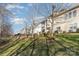 Landscaped backyard with a retaining wall and multiple exterior elevations of the home at 3046 Denali Way, Rock Hill, SC 29732