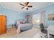 Bright bedroom features stylish decor, soft blue walls and a large window with natural light at 3046 Denali Way, Rock Hill, SC 29732