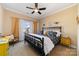Comfortable bedroom featuring a decorative black metal bed frame, cozy bedding, and natural light at 3046 Denali Way, Rock Hill, SC 29732