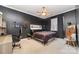 Bedroom showcases dark accent wall, contemporary decor, modern desk, and comfortable furnishings at 3046 Denali Way, Rock Hill, SC 29732