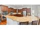 Spacious kitchen boasts granite countertops, wooden cabinetry, stainless steel appliances, and hardwood floors at 3046 Denali Way, Rock Hill, SC 29732