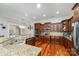 Gourmet kitchen with granite countertops, stainless steel appliances, custom cabinetry, and breakfast bar at 3046 Denali Way, Rock Hill, SC 29732