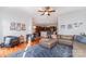 Spacious living room showcasing hardwood floors, modern furnishings, open to kitchen and ceiling fan at 3046 Denali Way, Rock Hill, SC 29732