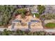 Aerial view of two charming homes with driveways surrounded by trees and natural landscape at 3365 34Th Avenue Ne Ct, Hickory, NC 28601