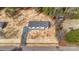 Aerial view of the home with gravel driveway surrounded by fresh mulch and scattered trees at 3365 34Th Avenue Ne Ct, Hickory, NC 28601