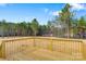 Wooden backyard deck with an expansive backyard space and trees at 3365 34Th Avenue Ne Ct, Hickory, NC 28601