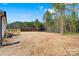 Backyard view from wooden deck showing open space and views of trees in the background at 3365 34Th Avenue Ne Ct, Hickory, NC 28601