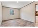 Bedroom features neutral walls, wood-look flooring, and a window offering natural light at 3365 34Th Avenue Ne Ct, Hickory, NC 28601