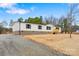Charming single-story home with a fresh gravel driveway and a neatly maintained front lawn at 3365 34Th Avenue Ne Ct, Hickory, NC 28601