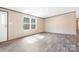 Bright living room featuring neutral walls, recessed lighting, and durable plank flooring at 3365 34Th Avenue Ne Ct, Hickory, NC 28601