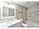 Modern bathroom featuring white marble-style tile, a vanity with a marble countertop, and a mirror at 343 Bell St, Mooresville, NC 28115