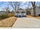 Charming exterior view of a home with a freshly poured concrete driveway and a cozy front porch at 343 Bell St, Mooresville, NC 28115