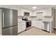 Bright kitchen featuring white cabinets, stainless steel appliances, and light-colored countertop at 343 Bell St, Mooresville, NC 28115