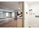 View from mudroom to living room featuring stainless steel appliances, and an open-concept design at 343 Bell St, Mooresville, NC 28115