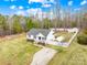 Aerial view of a well-maintained home featuring a spacious yard, driveway, and private backyard at 348 Fleetwood Rd, York, SC 29745