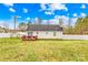 Backyard view of the home with a wooden deck and sliding glass door access at 348 Fleetwood Rd, York, SC 29745