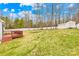 Expansive backyard view with partial fence and detached garage at 348 Fleetwood Rd, York, SC 29745