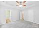 Spacious bedroom featuring neutral paint, ceiling fan and two closets at 348 Fleetwood Rd, York, SC 29745