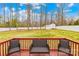 Deck with outdoor furniture overlooking a spacious backyard and distant treeline at 348 Fleetwood Rd, York, SC 29745