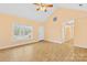 Spacious living room featuring vaulted ceilings, natural light, and access to the front porch at 348 Fleetwood Rd, York, SC 29745