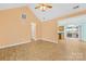 Open-concept living room connecting to the kitchen and featuring modern tile floors at 348 Fleetwood Rd, York, SC 29745