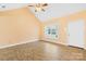 Bright, open living room with vaulted ceilings and stylish tile flooring at 348 Fleetwood Rd, York, SC 29745