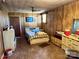 Retro bedroom featuring wood paneling, vintage furniture, and a cozy, lived-in feel at 4073 Lee Cline Rd, Conover, NC 28613