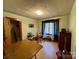 Large bedroom featuring hardwood floors, a window, and closet space at 4073 Lee Cline Rd, Conover, NC 28613