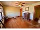 Bedroom featuring a window, hardwood floors, and a vintage chest at 4073 Lee Cline Rd, Conover, NC 28613