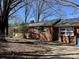 Brick home with a welcoming entrance, set among mature trees, with visible side driveway at 4073 Lee Cline Rd, Conover, NC 28613