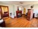 Spacious living room with fireplace, hardwood floors, and vintage furniture at 4073 Lee Cline Rd, Conover, NC 28613
