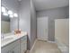 Bathroom with tiled floors, a white vanity, and a shower-tub combo, offering both style and functionality at 4080 Elks Park Rd, Rock Hill, SC 29732
