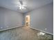 Bedroom featuring neutral walls, carpet floors, and a view to the bathroom at 4080 Elks Park Rd, Rock Hill, SC 29732