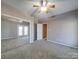 Spacious bedroom featuring neutral walls, carpet floors, and large sliding door closet with mirrored doors at 4080 Elks Park Rd, Rock Hill, SC 29732