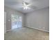 Spacious bedroom with a ceiling fan and sliding glass doors leading to an outdoor deck at 4080 Elks Park Rd, Rock Hill, SC 29732