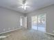Light-filled bedroom with a ceiling fan and sliding glass doors leading to an outdoor deck at 4080 Elks Park Rd, Rock Hill, SC 29732