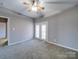 Bedroom featuring neutral walls, carpet floors, and access to outdoor patio at 4080 Elks Park Rd, Rock Hill, SC 29732