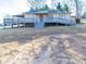 Charming home with a covered porch, convenient ramp access, and a spacious deck that's perfect for relaxing and entertaining at 4080 Elks Park Rd, Rock Hill, SC 29732