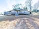 Charming home with a covered porch, convenient ramp access, and a spacious deck that's perfect for relaxing and entertaining at 4080 Elks Park Rd, Rock Hill, SC 29732