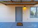 Close-up of the front door on the house's porch with a 