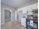 Kitchen features white cabinetry, modern appliances, and wood flooring at 4080 Elks Park Rd, Rock Hill, SC 29732