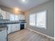 Bright kitchen features wood floors, lots of natural light and white cabinets at 4080 Elks Park Rd, Rock Hill, SC 29732