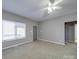 Living room featuring neutral walls, carpet, large window, and ceiling fan at 4080 Elks Park Rd, Rock Hill, SC 29732