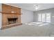 Cozy living room with a brick fireplace and access to the outdoor deck at 4080 Elks Park Rd, Rock Hill, SC 29732