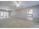 Spacious living room featuring neutral walls, carpet, and a ceiling fan at 4080 Elks Park Rd, Rock Hill, SC 29732