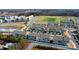 Drone shot highlighting a new townhome community near athletic fields, apartments and local businesses at 419 Burr St, Indian Trail, NC 28079